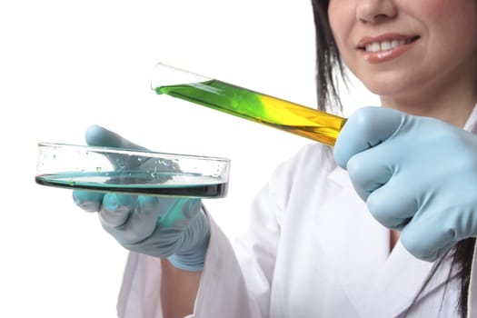 Laboratory research worker with test tube and petri dish