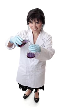 A smiling scientist using laboratory equipment.
