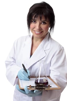A scientist, chemist or laboratory worker with data worksheet and laboratory equipment.  She is looking up and smiling cheerfully.