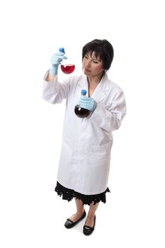 Chemist holding two glass flasks of chemicals