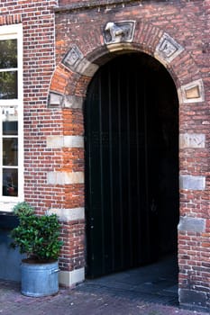 Old gate in small street, build in the year 1615.