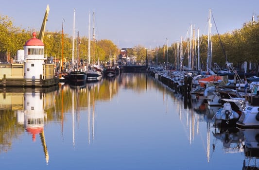 Harbour on autumn morning with ships and blue sky