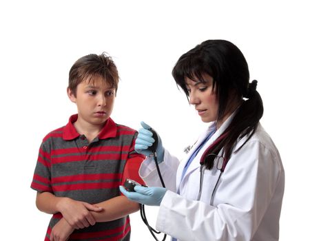 A doctor pumping up a blood pressure cuff to measures a patient's blood pressure.