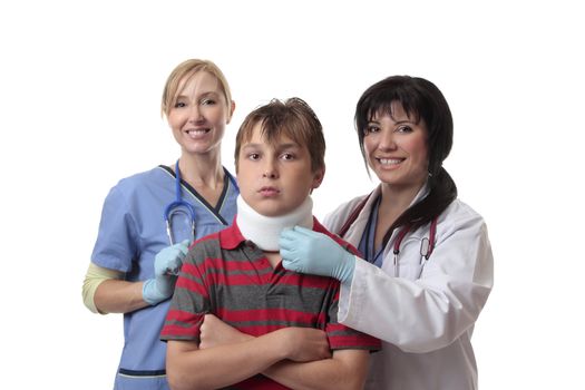 Smiling medical doctor and nurse and child fitted with a cervical collar.