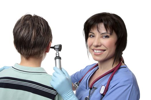 A female doctor using an otoscope to check the ears of a patient.