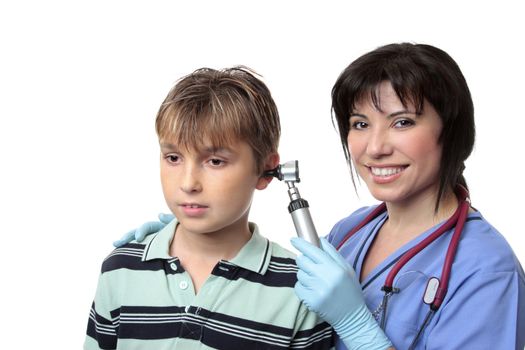 A doctor checks a boys ears with an otoscope (auroscope)
