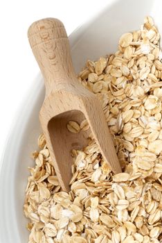 Seeds of oats цшер wooden spatula. Macro