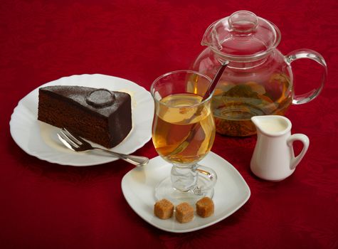 Still life. Ginger tea, chocolate cake and cane sugar.