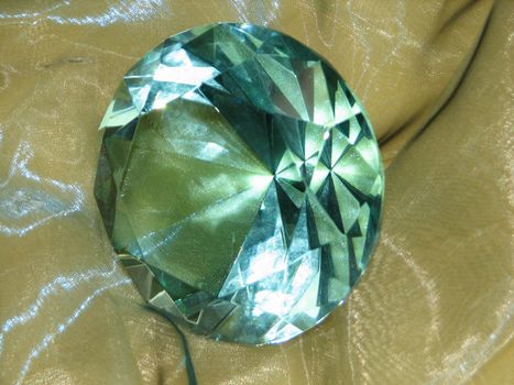 Glass cut in form of a gemstone