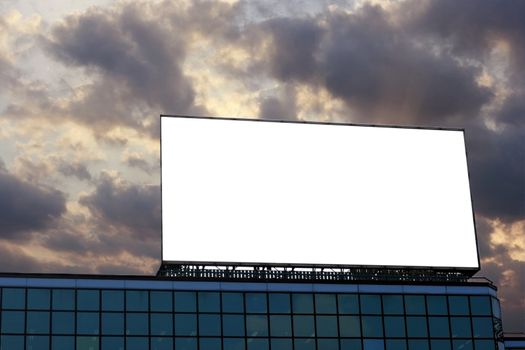 Blank Billboard  on top of a building in dusk background