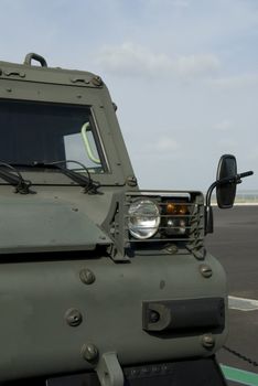 Front detail of tracked military vehicle for transportation of troops