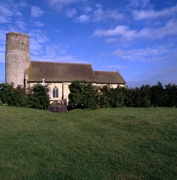 Round tower churches of East Anglia situated in the middle of a field