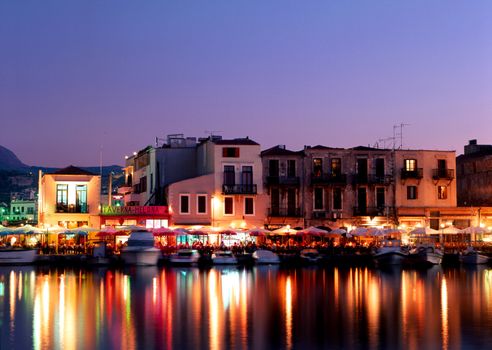 Lights from tavernas over Rethymnon harbour, Crete, Greece