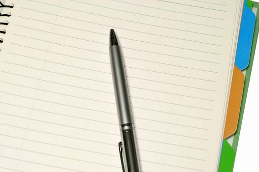 Notepad with a Pen in a white background