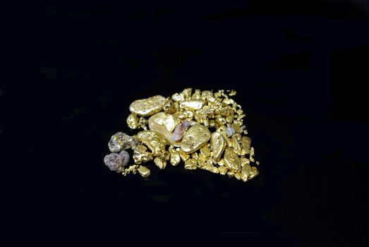 Gold nuggets, flakes and dust mined from the creeks and rivers of california