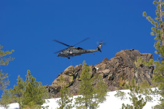 Air rescue by helicopter in the mountains at high altitude