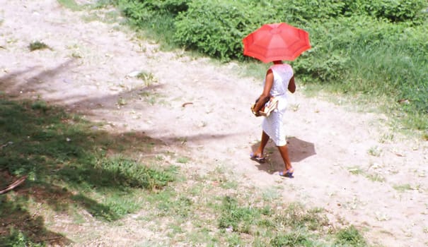 Caribbean woman walking to work.