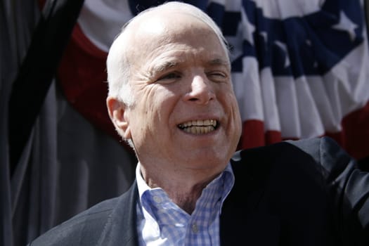 John McCain smiling for camera