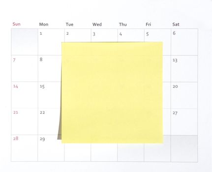 Yellow Simple Plain Blank Post-It Note On A Calendar, Space For Own Text, Background