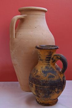 Plain earthenware jar and decorated jug