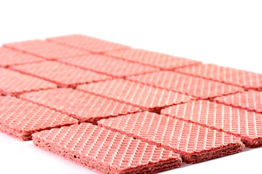 Pink sweet wafers are laid out by equal numbers.