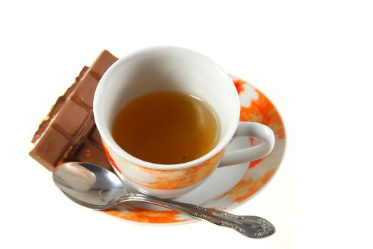cup of tea with chocolate on white background
