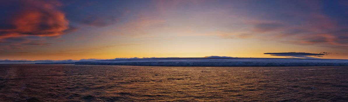 Frozen coastline at sunset.  Horizontally framed shot.
