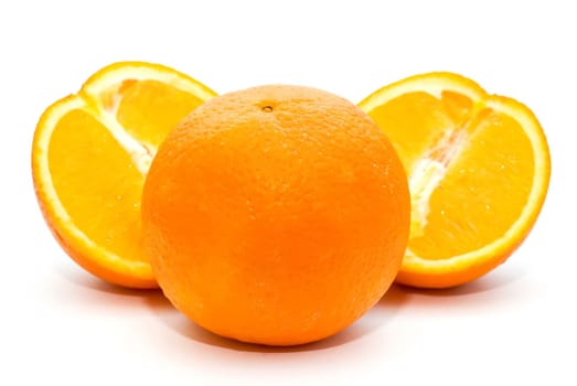 three oranges on a white background