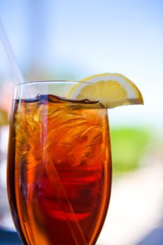 Image of a cold glass of iced tea with lemon