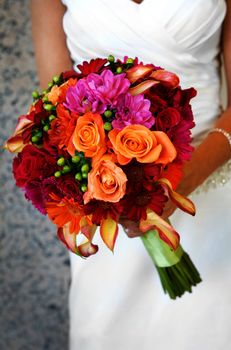 Image of a bride holding colorful bouquet