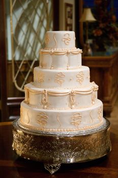 Classic wedding cake with gold icing