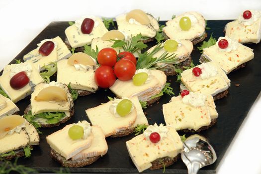 Cheese platter with different types of cheese grapes