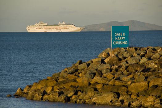 Cruise ship laying on the ocean, view from port.