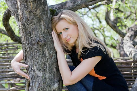 Portrait of the girl having a rest in the summer in park