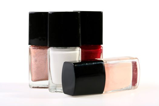 Set of a varnish for manicure in small bottles with brushes.