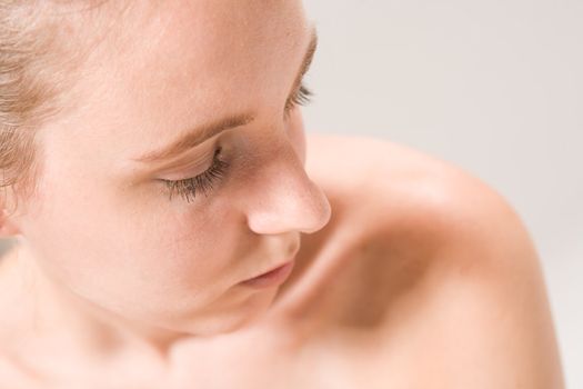 Studio close up portrait of a beautiful woman