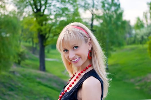 Portrait of the beautiful girl in spring park