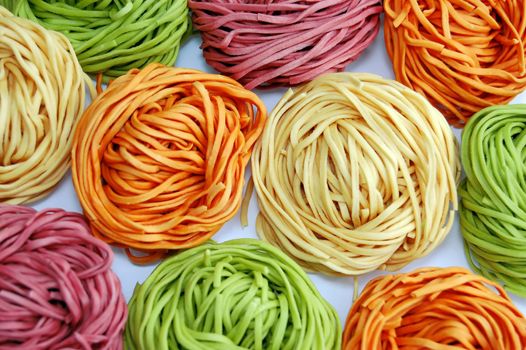 colored pasta or colored noodles redy for cooking