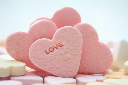 pink candy hearts with the word love