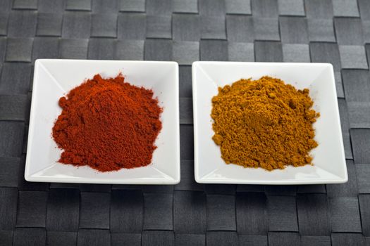 curry and paprika powder on small plates