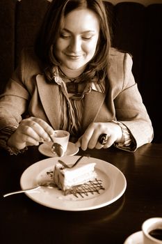 Young female eating a cake