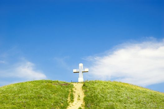 path to the cross on the top of green hill