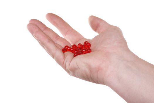 Hand with red pills.  Isolated on white [with clipping path].