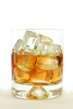 glass of whisky on the rocks isolated on white