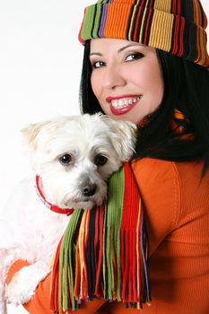 Joy of pets.   Beautiful woman cuddling a pet dog.