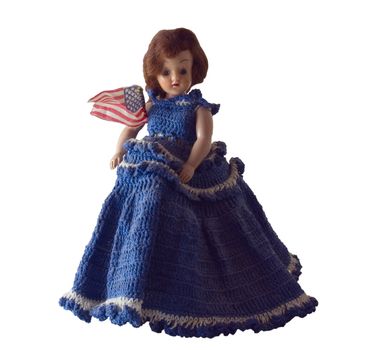 Antique doll in hand crocheted dress with American Flag.