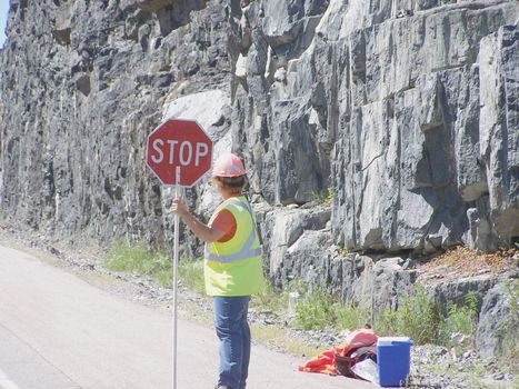 woman flagman on a road site construction site non traditional job