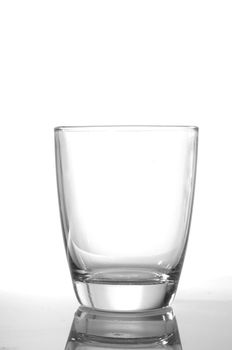 photo of pouring water and glass on white background