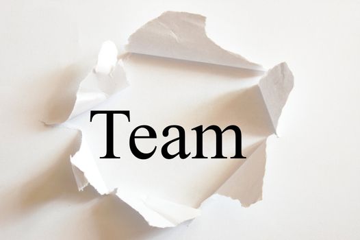 teamwork concept with a hole in white paper