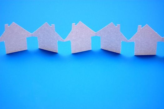 paper houses or homes showing a concept for real estate